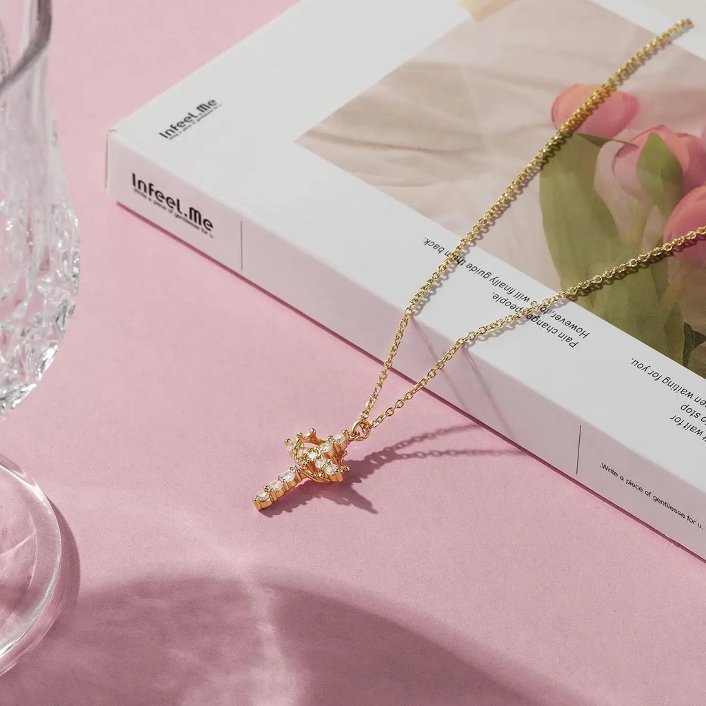 Rotating Crown Cross Necklace